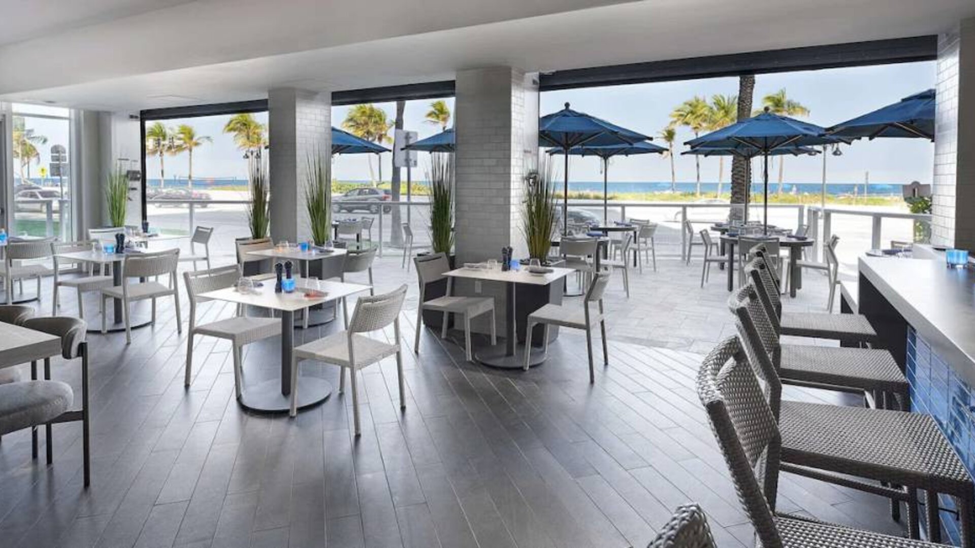 Sonesta Fort Lauderdale Beach’s Steelpan Restaurant serves up Caribbean-American fusion fare, with small tables, a hard floor and ocean views.