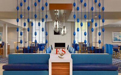 Sonesta ES Suites Flagstaff’s lobby has extensive seating where guests to relax and socialize, or watch the wall-mounted TV.