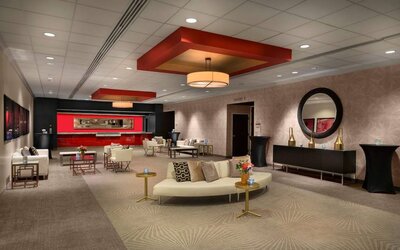 The lounge in Sonesta Philadelphia Rittenhouse Square’s lobby is furnished with sofas and comfy chairs, numerous coffee tables, and is a spacious setting.