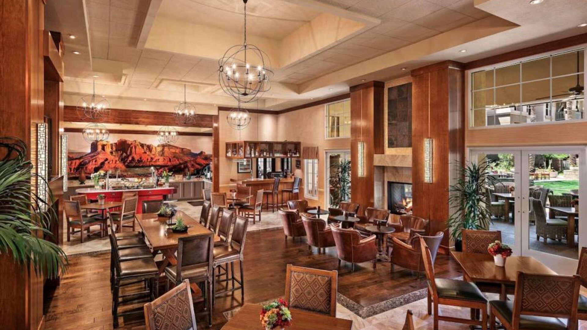 The hotel’s Heart Room Patio serves up breakfast in a setting of high ceilings and toasty fireplaces, with tables of varying sizes and numerous potted plants.