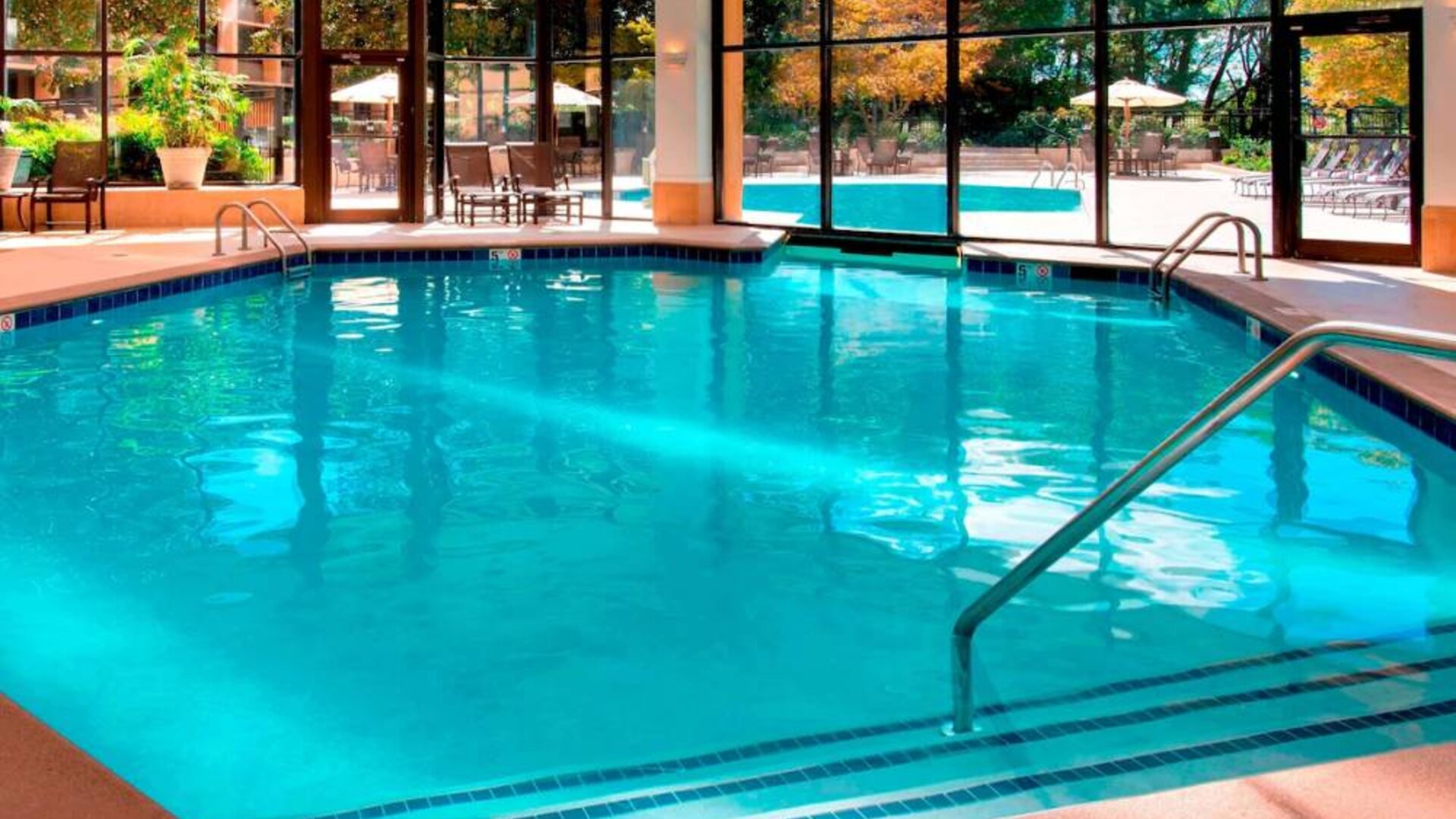 The hotel’s indoor pool has chairs by the side and a direct water link to the outside pool.