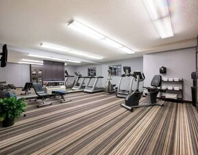 Sonesta Simply Suites Huntsville Research Park’s fitness center has wall-mounted televisions and is equipped with free weights and a variety of exercise machines.