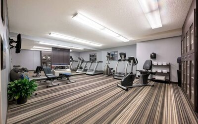 Sonesta Simply Suites Huntsville Research Park’s fitness center has wall-mounted televisions and is equipped with free weights and a variety of exercise machines.