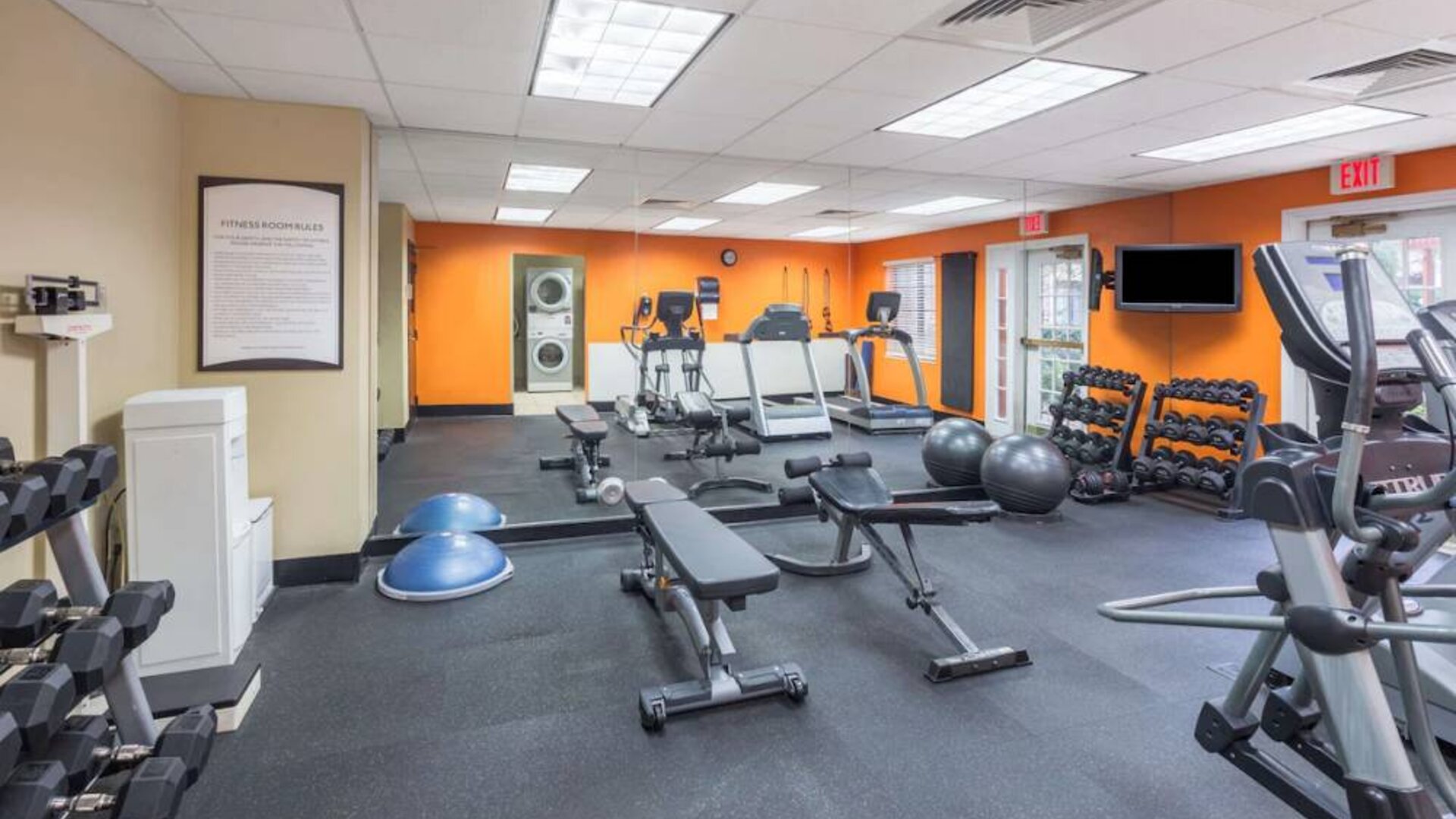 Sonesta ES Suites Atlanta - Perimeter Center’s fitness center has both free weights and a range of exercise machines, plus benches and a wall-mounted TV.