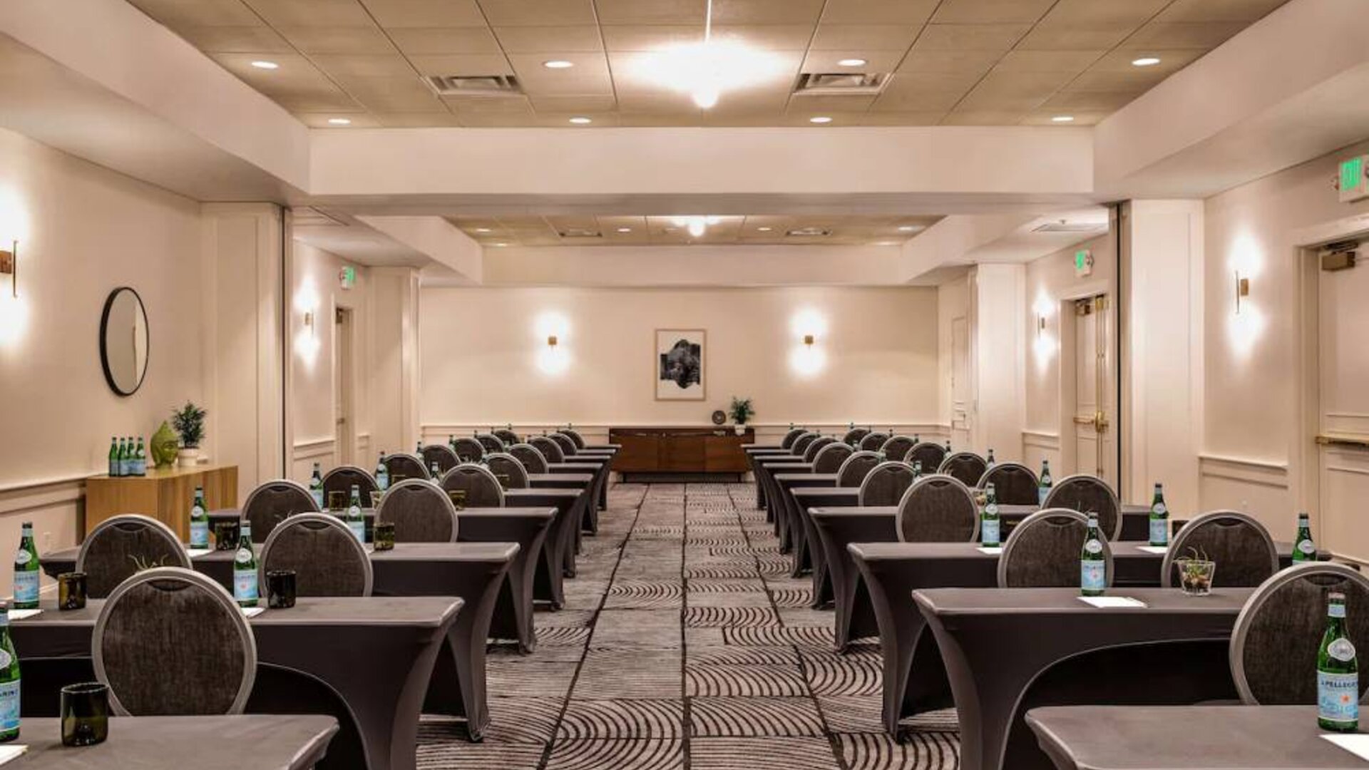 Royal Sonesta Portland Downtown meeting room, with tables arranged in a classroom format and seating for dozens of attendees.