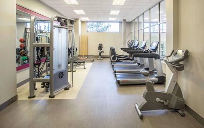 Sonesta Milwaukee West Wauwatosa’s fitness center is equipped with gym balls and various types of exercise machines.