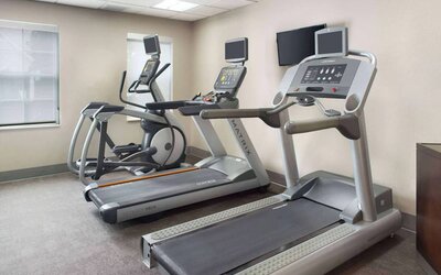 The hotel’s fitness center is equipped with various types of exercise machine, and has a wall-mounted television.