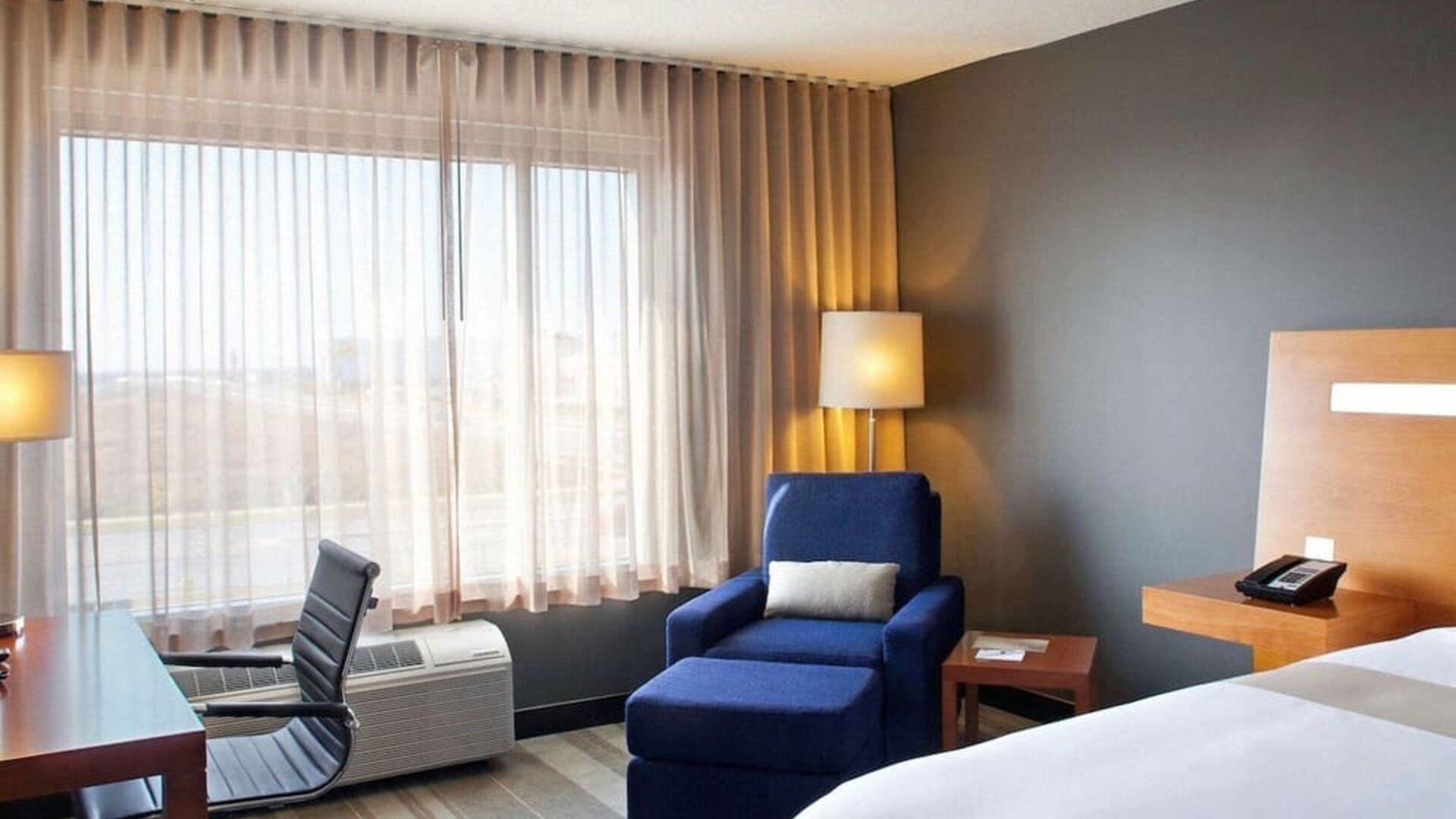 Delux king room with natural light at Novotel Toronto Vaughan Centre.