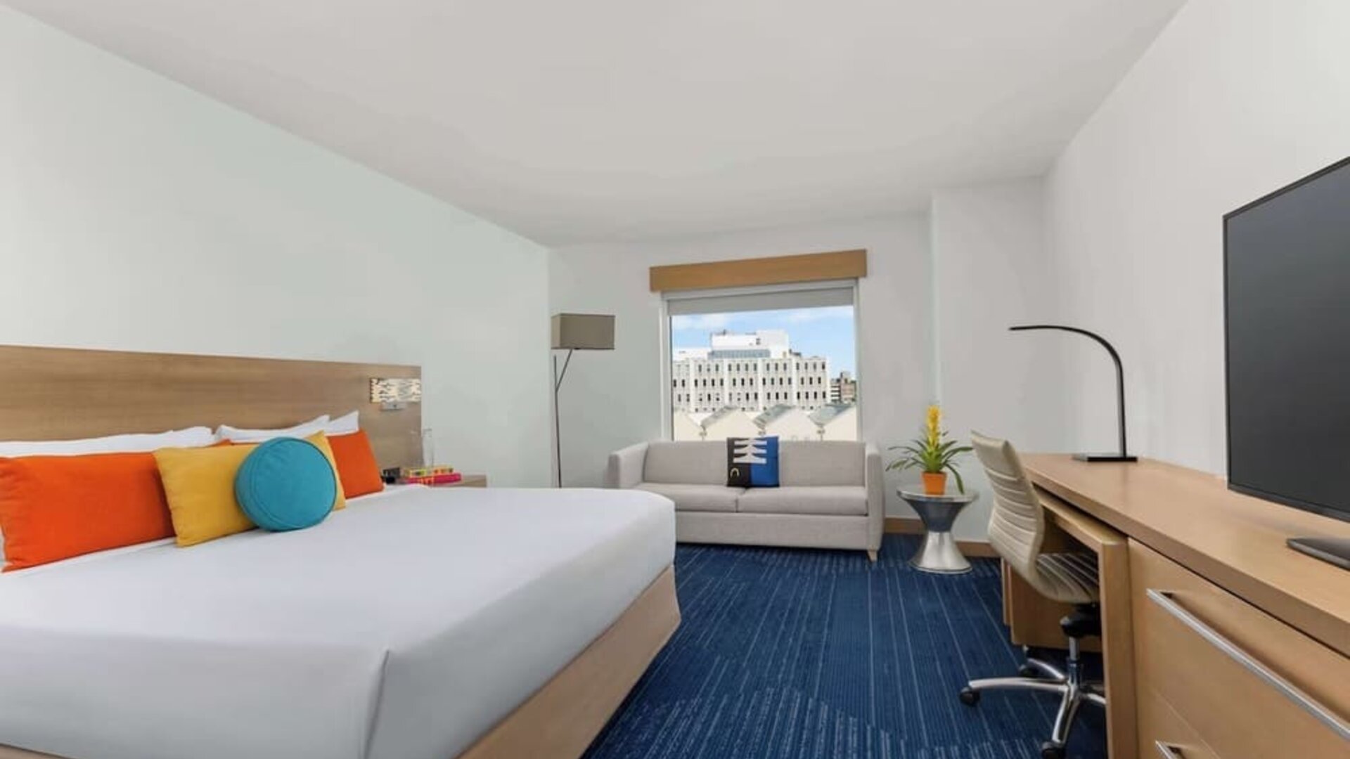 King room with TV and work space at The Art Hotel Denver.