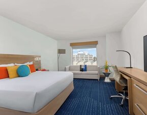 King room with TV and work space at The Art Hotel Denver.