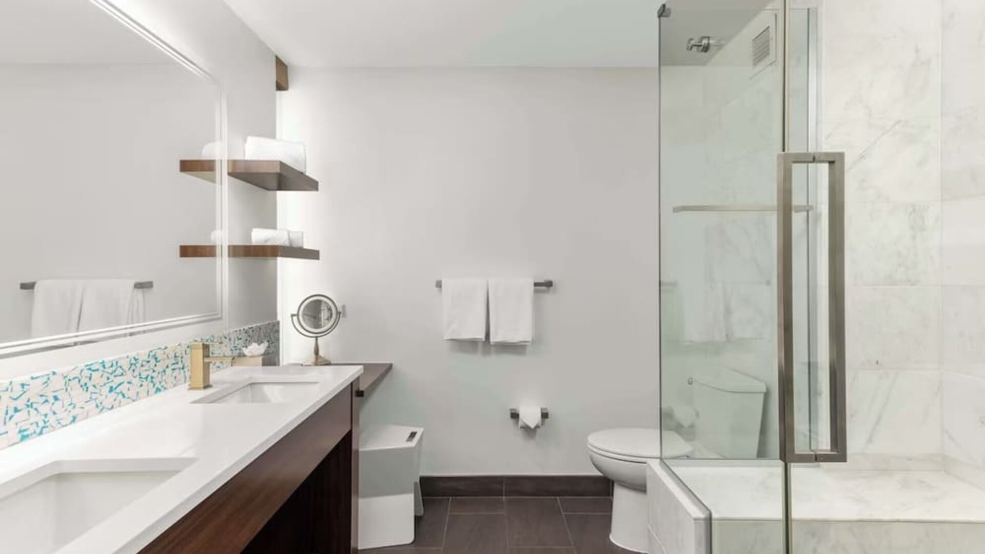 Private guest bathroom with shower at The Art Hotel Denver.