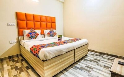 Comfortable king bed at Hotel Smart Stay. 