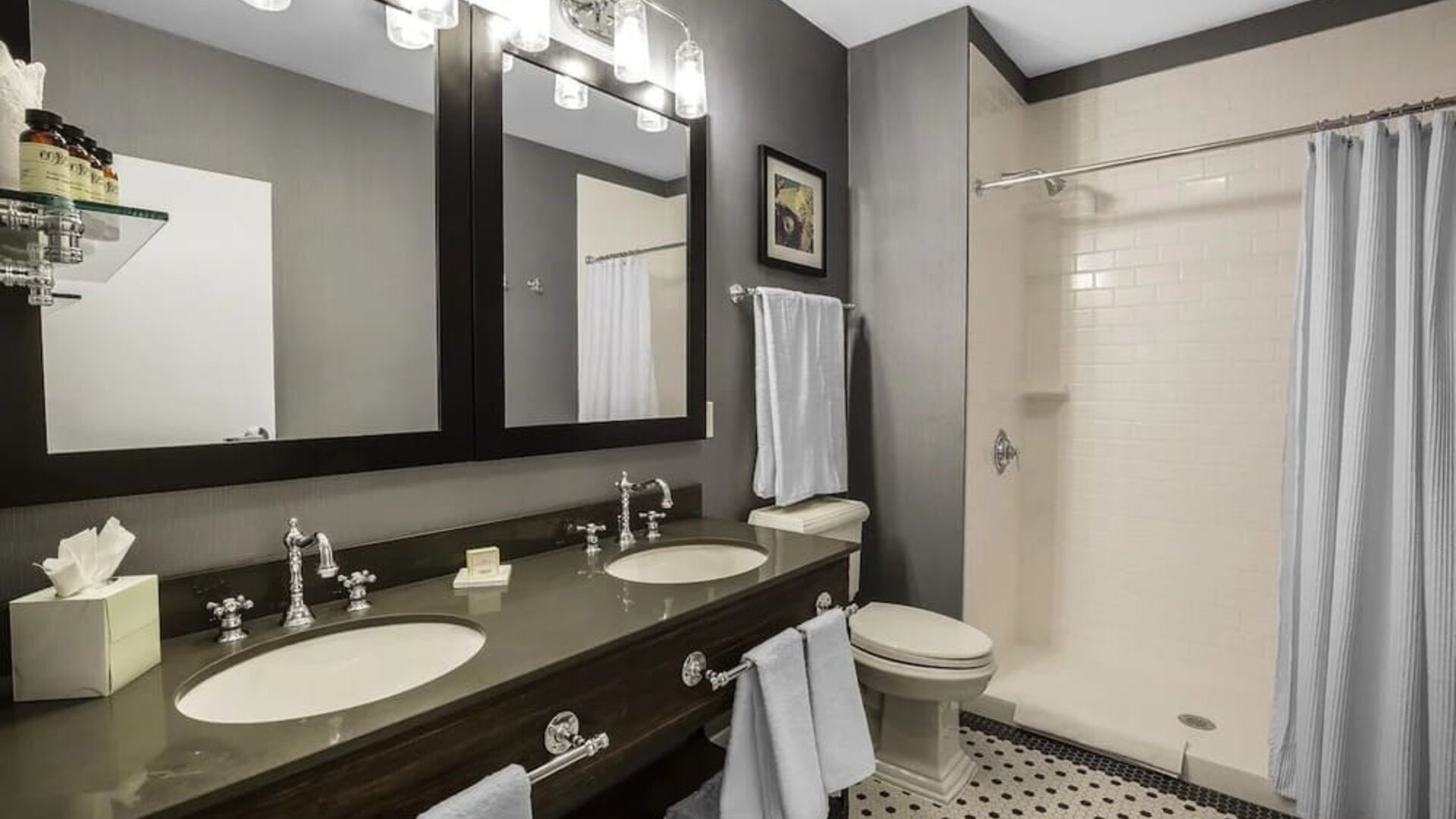 Guest bathroom with shower at EnVision Hotel St. Paul South.