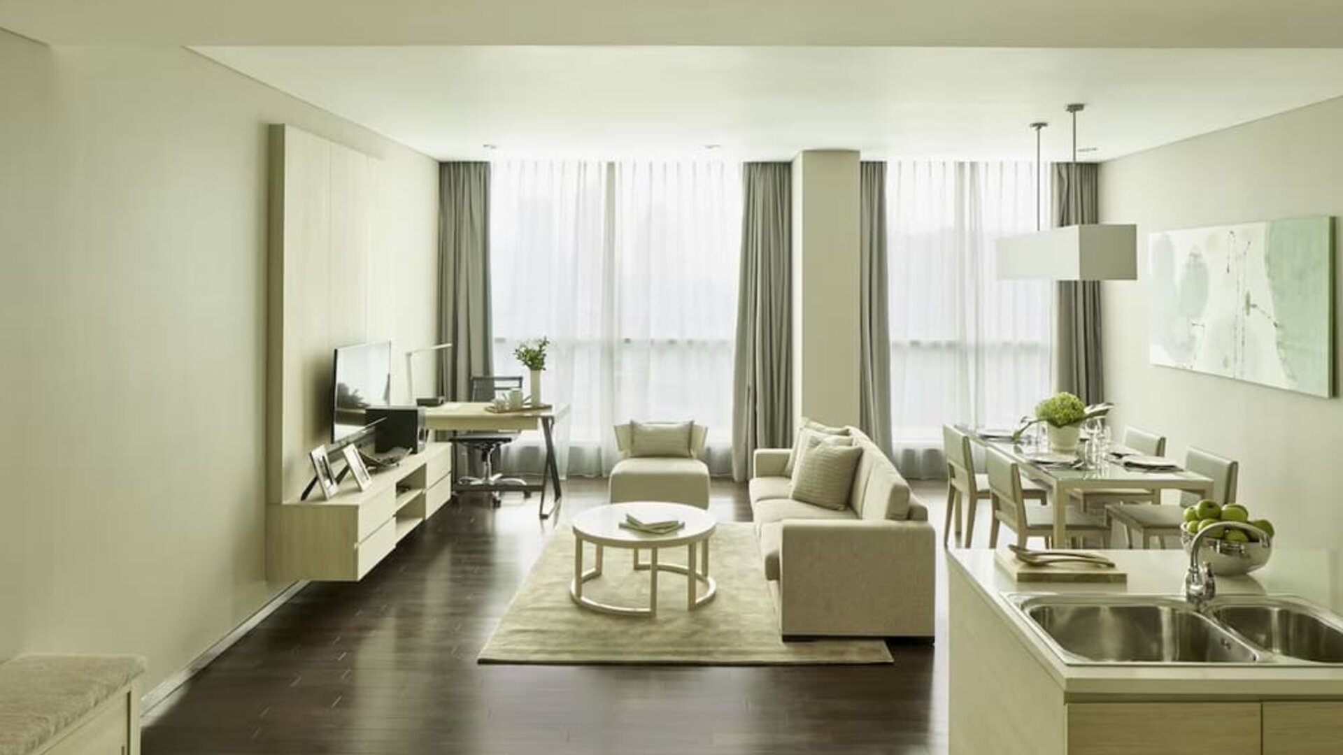 Spacious day room with kitchen and lounge at Fraser Residence Menteng Jakarta.