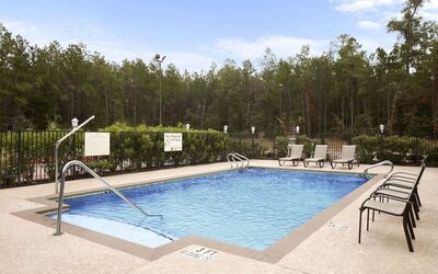 Relaxing outdoor pool at Hampton Inn & Suites Conroe - I-45 North.