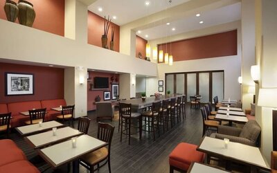 Coworking space and dining area at Hampton Inn & Suites Conroe - I-45 North.
