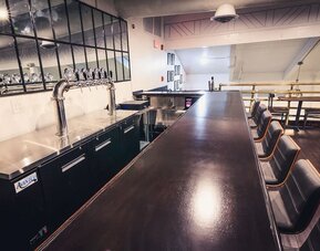 Bar and coworking space at EnVision Hotel Miami International Airport.