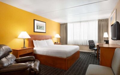 Spacious king room with work desk at EnVision Hotel Miami International Airport.