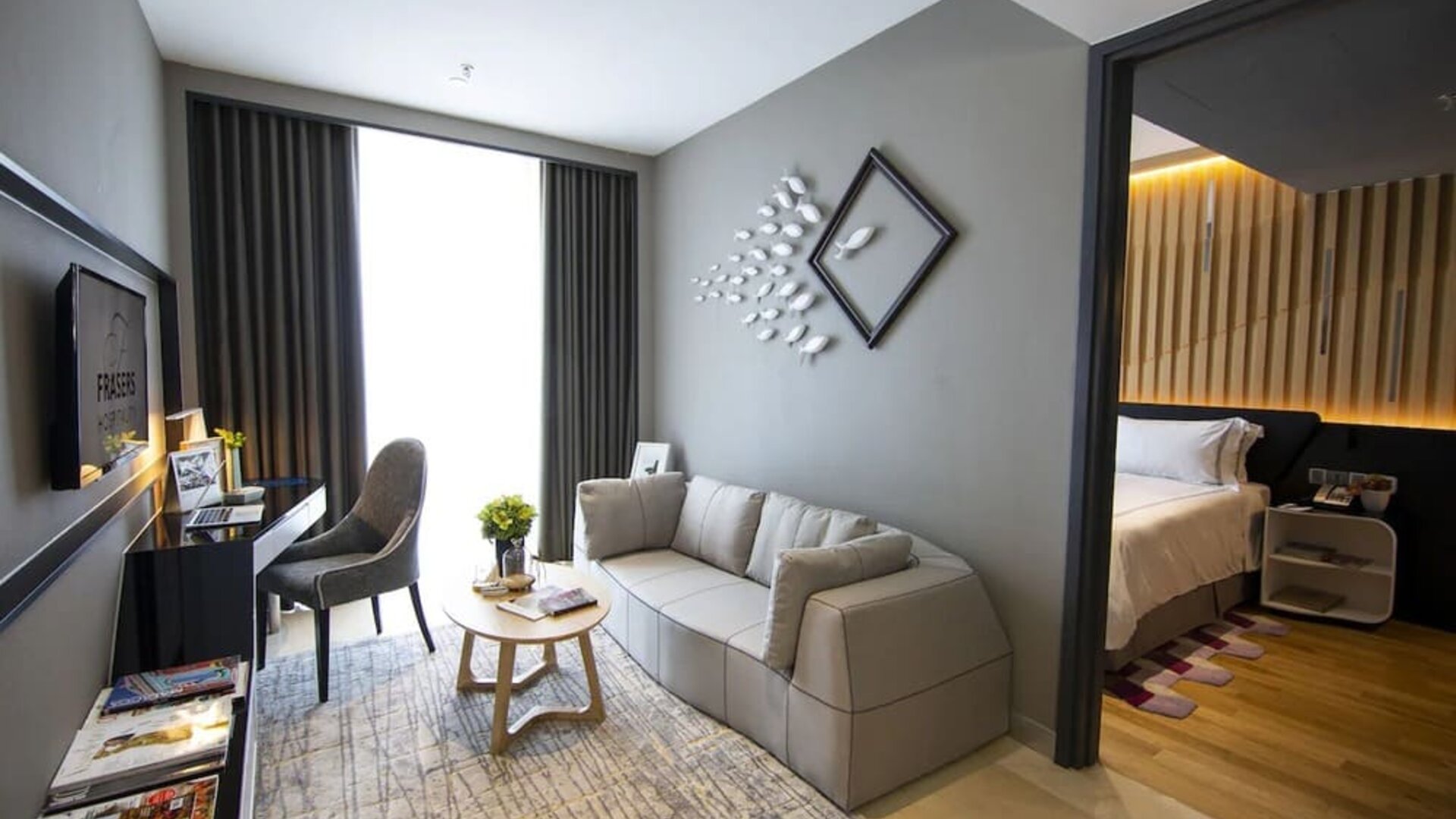 Large king room with lounge and work desk at Fraser Place Puteri Harbour.