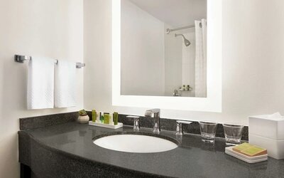 Guest bathroom with shower at Hilton Scottsdale Resort & Villas.