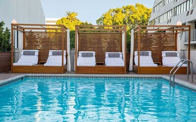 Pool cabanas and pool chairs at Hotel Dena, Pasadena Los Angeles.
