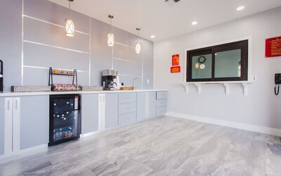 Kitchen and dining area at Palace Inn I-10 West & Beltway 8.