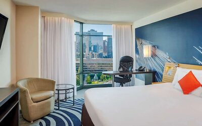 King room with TV at Novotel Toronto North York.