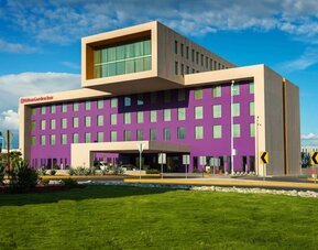 Hotel exterior and parking at Hilton Garden Inn Monterrey Airport, Nuevo Leon, Mexico.