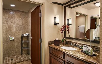 Guest bathroom with shower at Sonesta Suites Scottsdale Gainey Ranch.