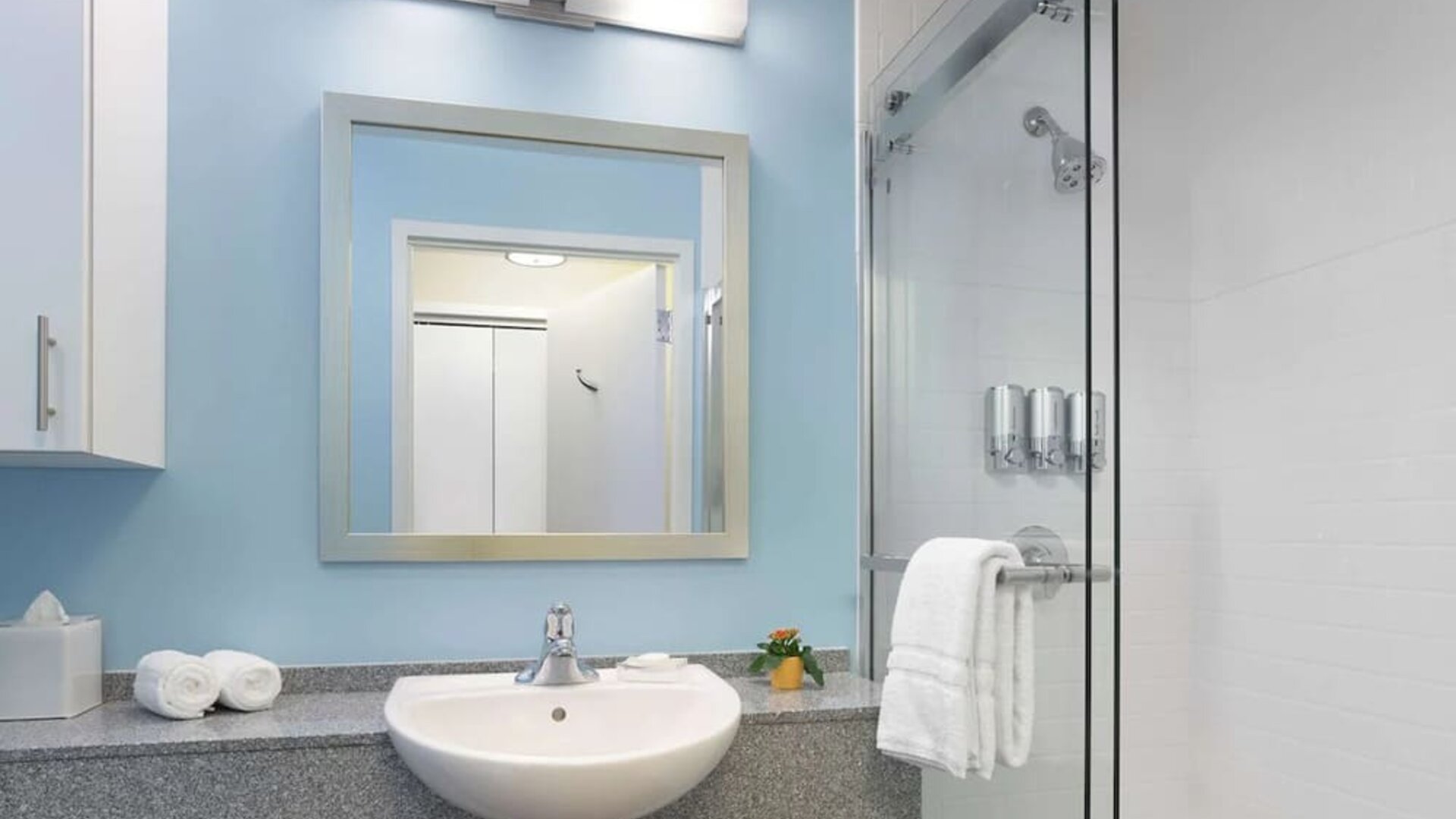 Guest bathroom with shower at Sonesta ES Suites New Orleans.