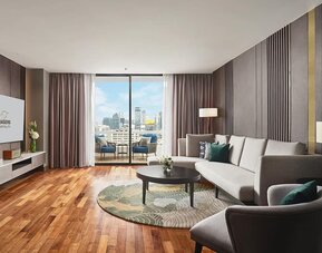 Beautiful king room with lounge and terrace at Fraser Suites Sukhumvit, Bangkok.