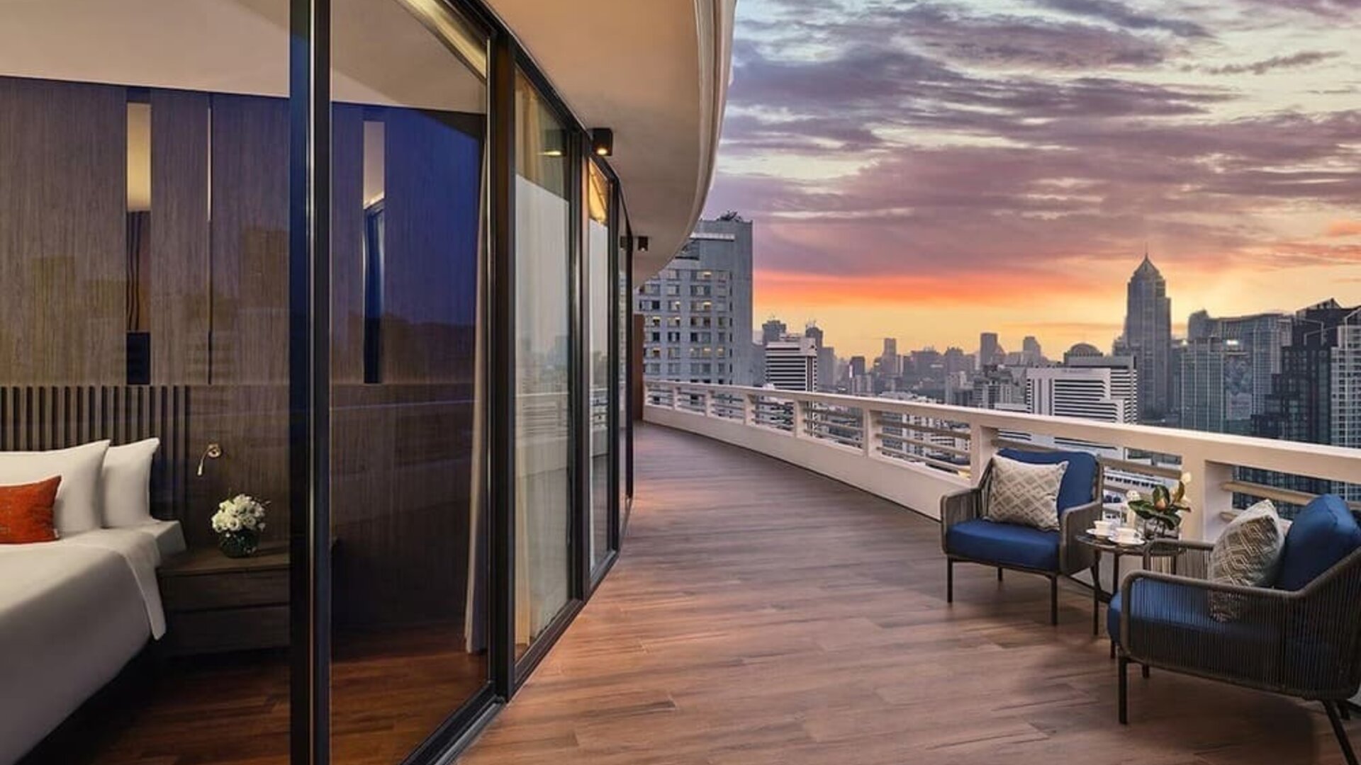 Outdoor terrace with seating area at Fraser Suites Sukhumvit, Bangkok.