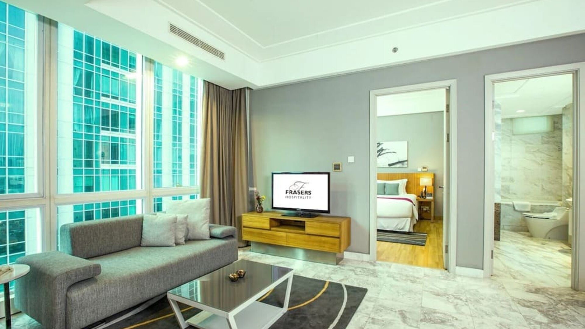 Spacious day yse room with lounge at Fraser Residence Sudirman Jakarta.