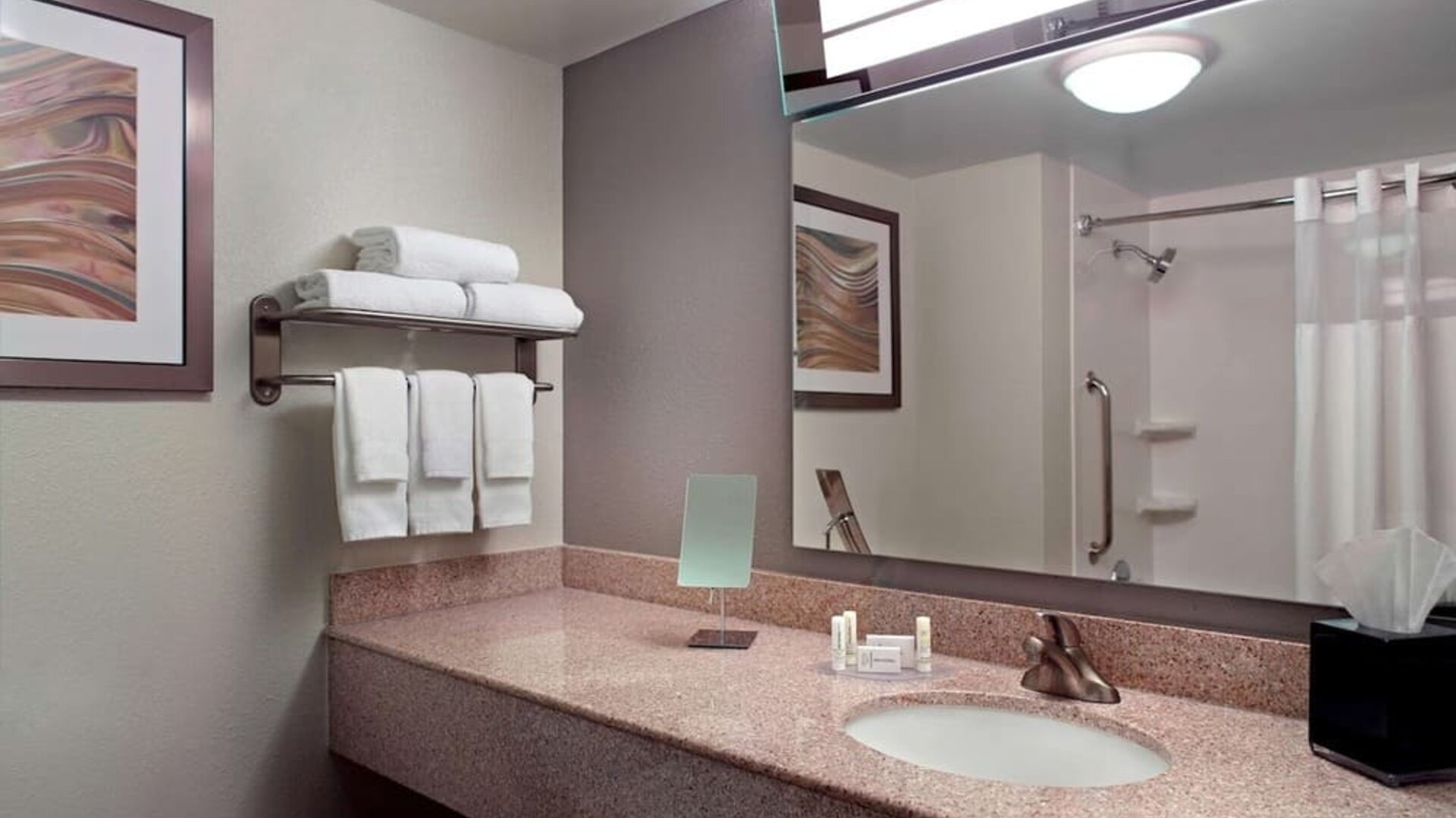 Guest bathroom with showre at Sonesta Select Atlanta Cumberland Galleria.