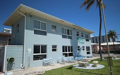 Hotel with lounge chairs at Shore View Hotel.