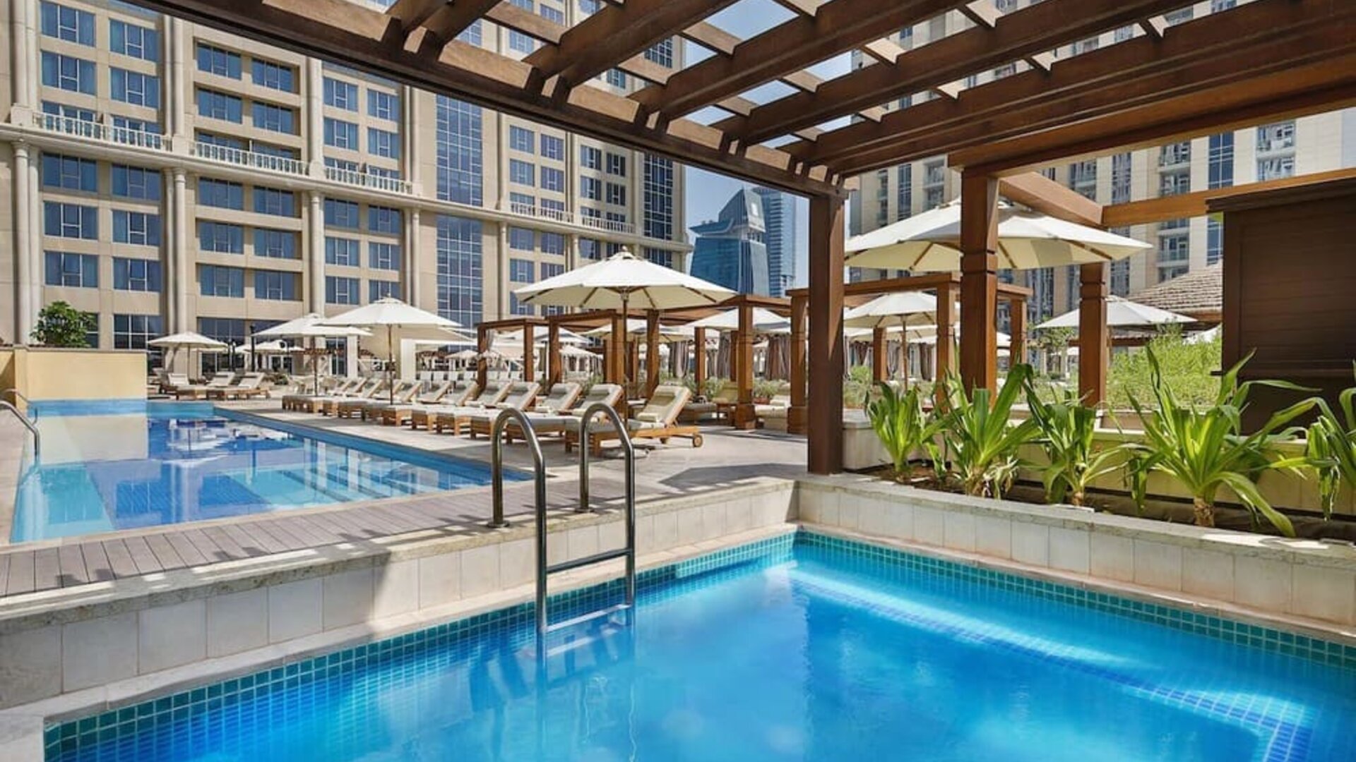 Three outdoor pools at Hilton Dubai Al Habtoor City.