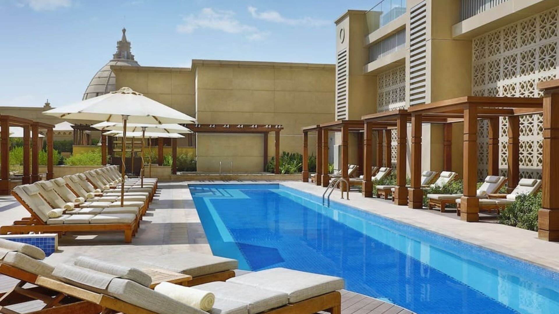 Pool lounge chairs at Hilton Dubai Al Habtoor City.