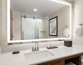 Private bathroom at Embassy Suites By Hilton Portland Airport.