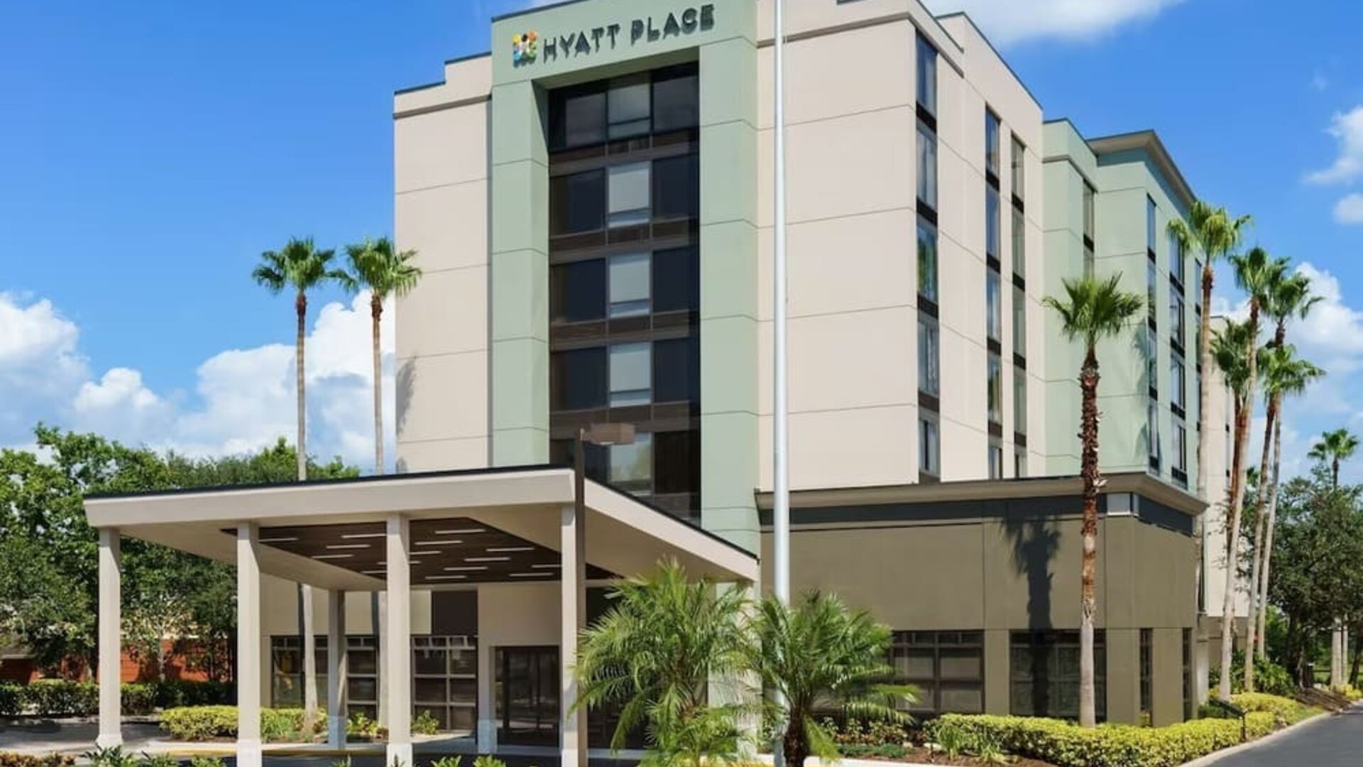 Hotel exterior and parking at Hyatt Place Orlando I-Drive.