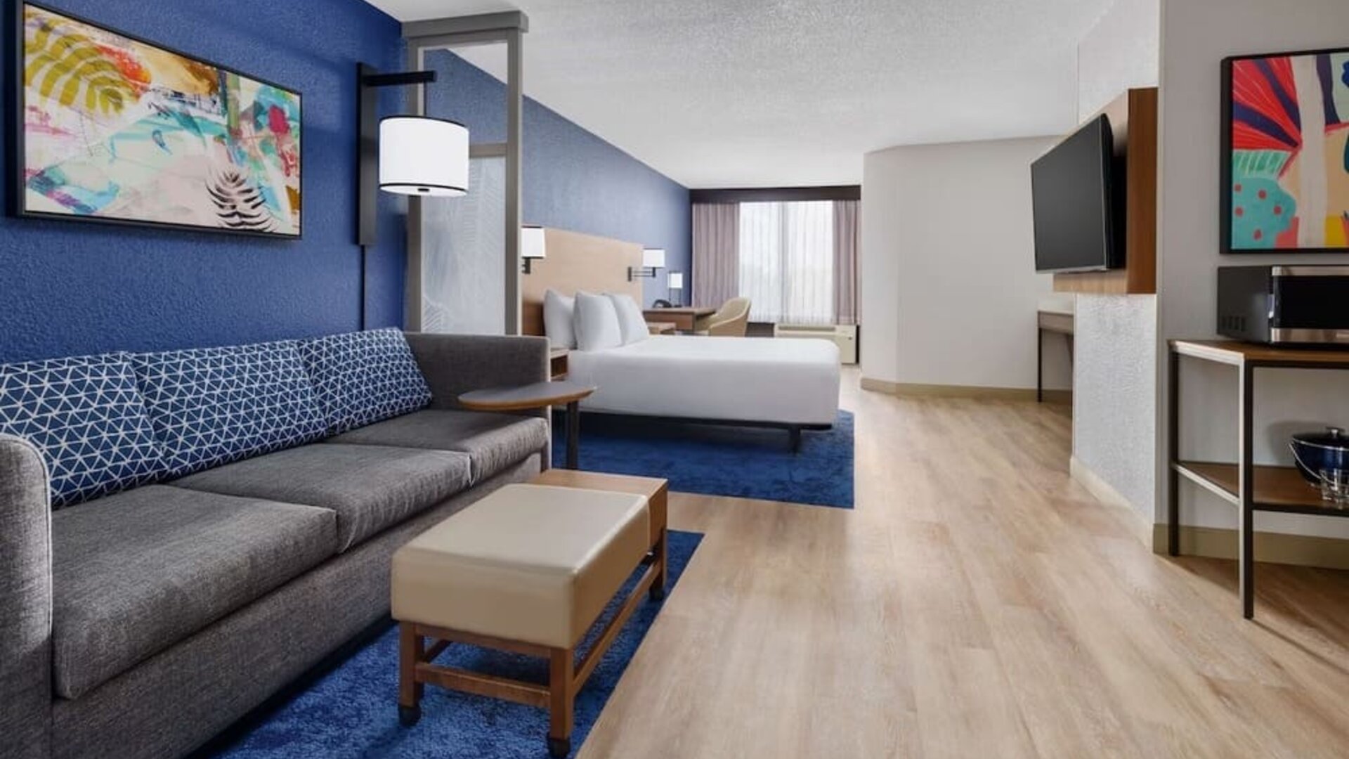 Day use room with lounge area and TV at Hyatt Place Orlando I-Drive.