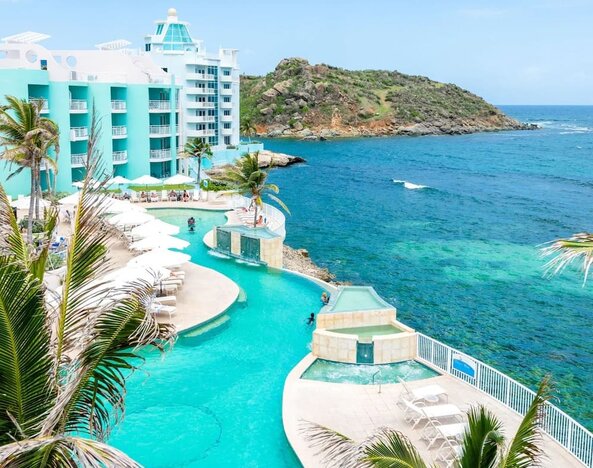 Stunning outdoor pool and ocean view at Oyster Bay Beach Resort.