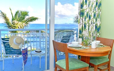 Sunset on the patio near a work desk of a day room at Oyster Bay Resort in St. Maarten.