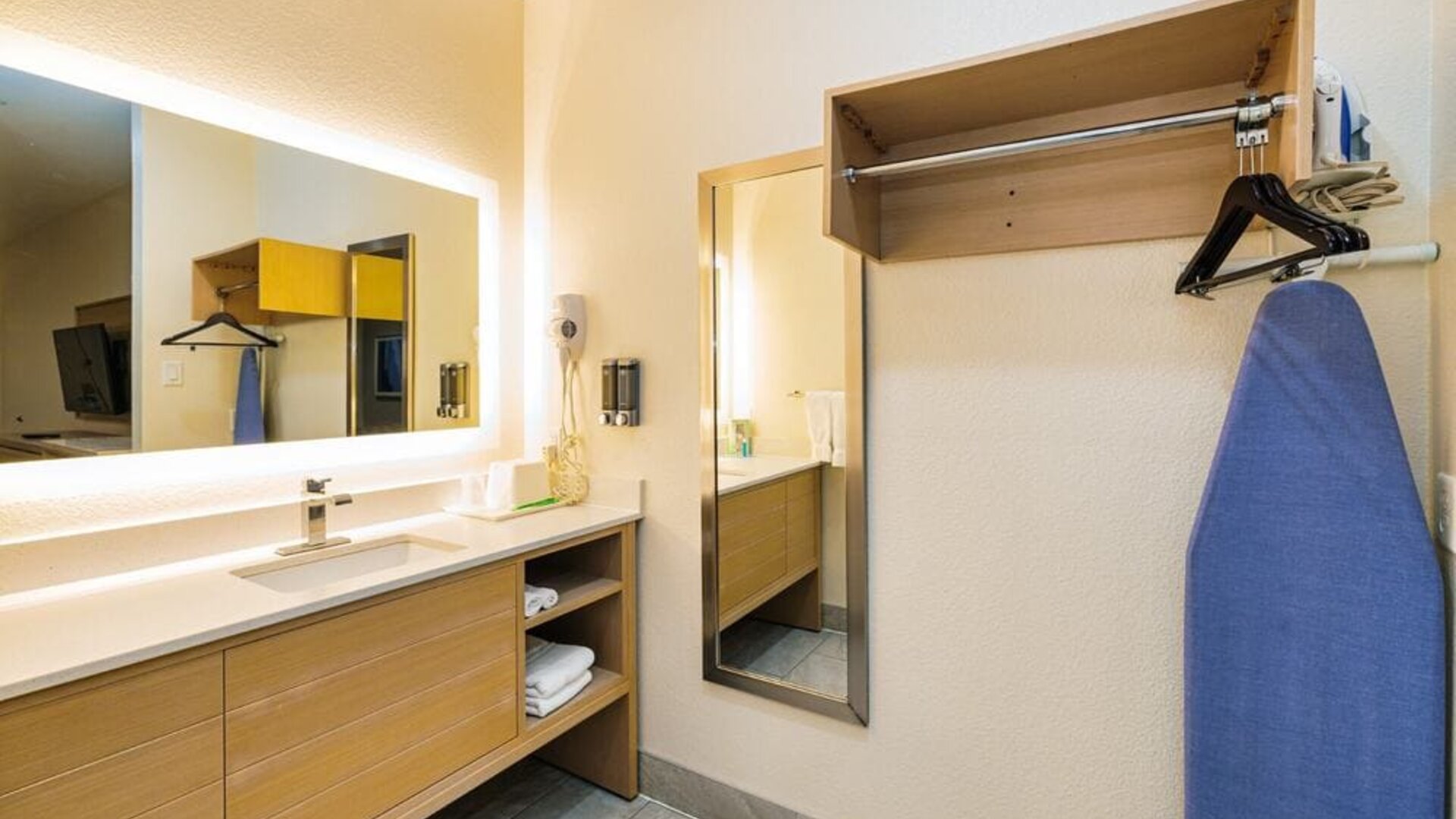 Guest bathroom with shower at Palace Inn Blue IAH East.