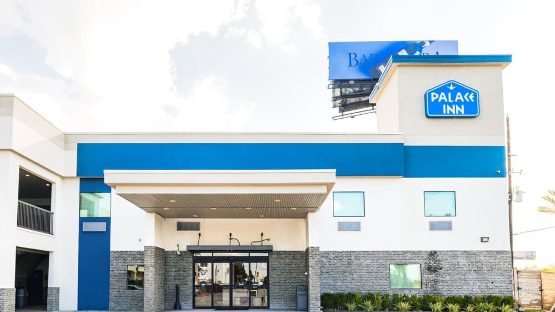 Hotel exterior at Palace Inn Blue IAH East.