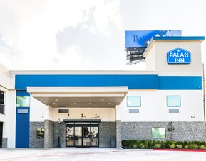 Hotel exterior at Palace Inn Blue IAH East.