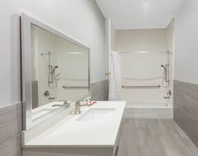 Guest bathroom at Baymont By Wyndham Houston Hobby Airport.