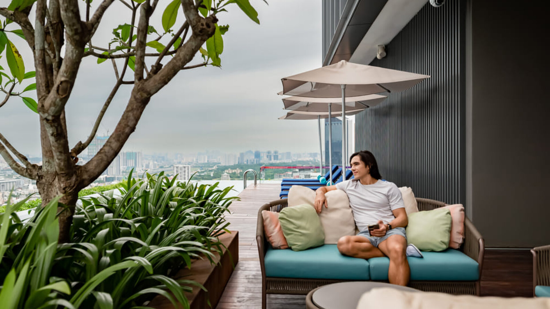 Outdoor pool with pool chairs at Capri By Fraser Bukit Bintang.