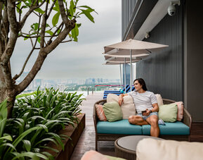 Outdoor pool with pool chairs at Capri By Fraser Bukit Bintang.