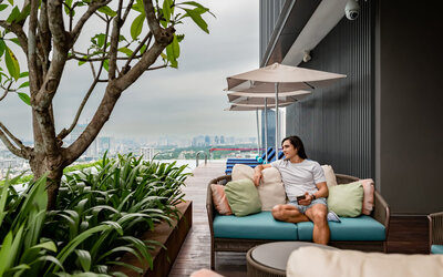Outdoor pool with pool chairs at Capri By Fraser Bukit Bintang.