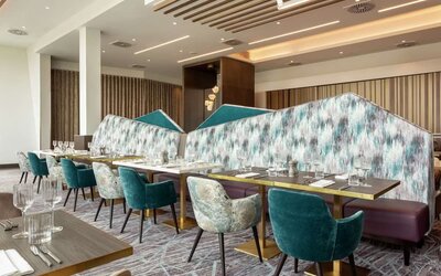 Dining room with natural light at Hilton Aberdeen TECA.